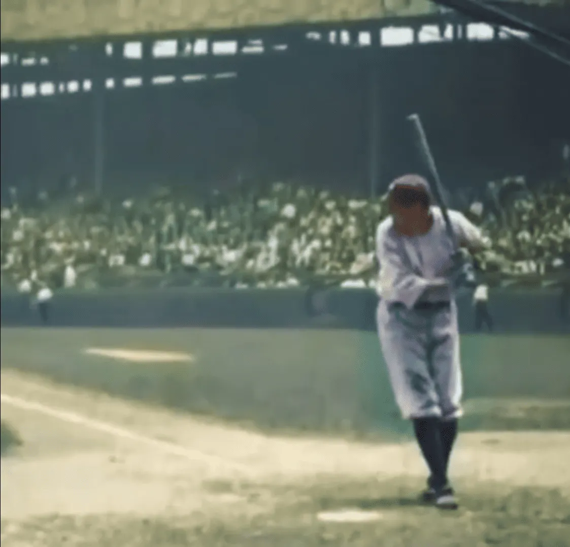 Babe Ruth mid-swing with his iconic cross foot stance